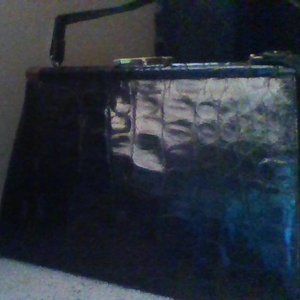 a vassar black alligator handbag